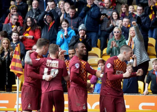 Jamie Proctor celebrates his second goal for Bradford City against Doncaster Rovers with the fans.