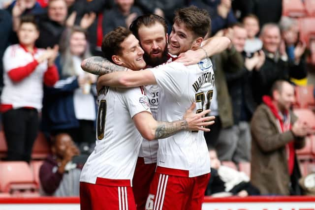 John Brayford celebrates scoring the first goal with Billy Sharp and Ben Whiteman.