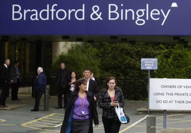 Library image of staff leaving The Bradford & Bingley HQ in Bingley, September 29, 2008. Picture Bruce Rollinson