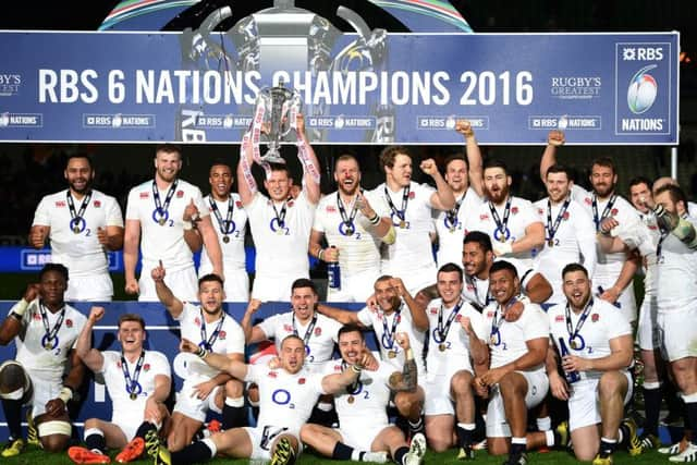 Englands captain Dylan Hartley hoists the RBS Six Nations trophy after victory over France at the Stade de France, Paris, completed the Grand Slam (Picture: Andrew Matthews/PA Wire).