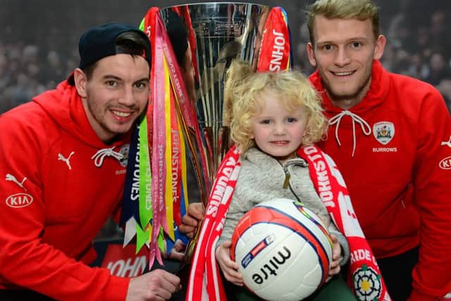 WEMBLEY-BOUND: Barnsleys Adam Hammill and Adam Davies with Jackson Schofield and the JP Trophy ahead of the final. Picture: Scott Merrylees