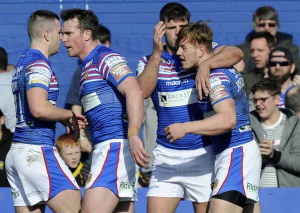 Tom Johnstone celebrates his first try for Wakefield Trinity Wildcats. (Picture: Bruce Rollinson)