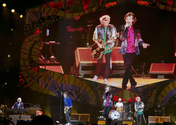 Keith Richards plays his guitar as the Rolling Stones perform in Havana, Cuba, Friday March 25, 2016. The Stones are performing in a free concert in Havana Friday, becoming the most famous act to play Cuba since its 1959 revolution. (AP Photo/Enric Marti)