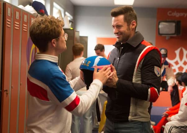 Eddie the Eagle. Pictured: Taron Egerton and Hugh Jackman.