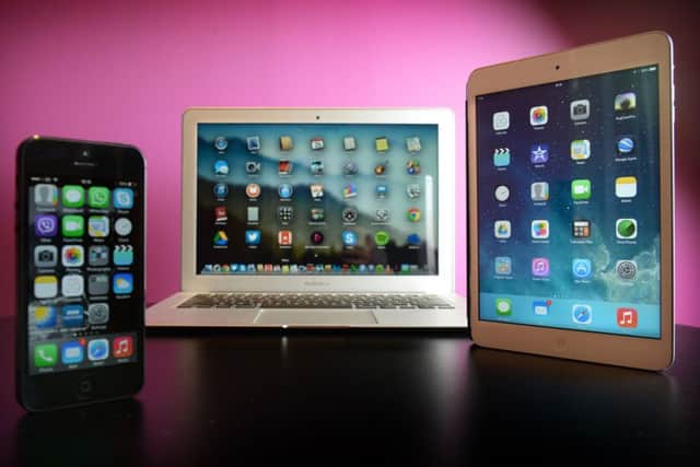 An Apple iPhone 5, MacBook Air and iPad Mini