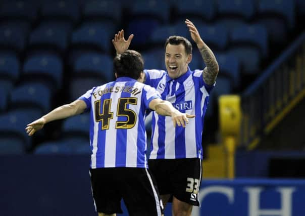 WHAT A FEELING: Ross Wallace celebrates with Fernando Forestieri after netting for the Owls against Blackburn Rovers. Picture: Steve Ellis.