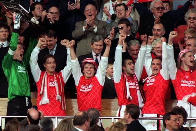 Rotherham United goalkeeper and captain Matthew Clarke celebrates with teammates after winning the Auto Windscreens Shield at Wembley beating Shrewsbury Town 2-1. (Picture: Neil Munns/PA)