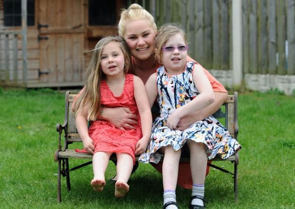 Eight-year-old Kyra Lodge pictured at home in Fitzwilliam with mum Heather and sister Poppie.
22nd April 2016.
Picture : Jonathan Gawthorpe