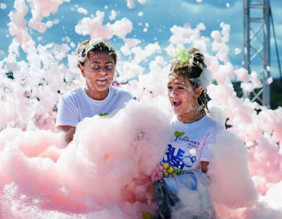 St Gemmas Hospice fundraisers take part in the first ever Bubble Rush at Harewood House in Leeds. Pictured runners making their way through the bubbles.
23nd April 2016.
Picture : Jonathan Gawthorpe