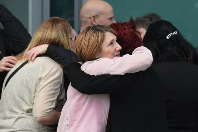 Relatives of those who died in the Hillsborough disaster celebrate outside the Hillsborough Inquest in Warrington