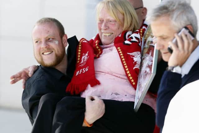 Relatives of those who died in the Hillsborough disaster celebrate outside the Hillsborough Inquest in Warrington, where the inquest jury concluded that the 96 Liverpool fans who died in the Hillsborough disaster were unlawfully killed.