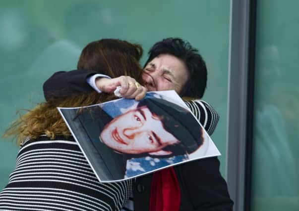 Relatives of victims of the Hillsborough tragedy embrace after an inquest ruled that 96 Liverpool fans were unlawfully killed.