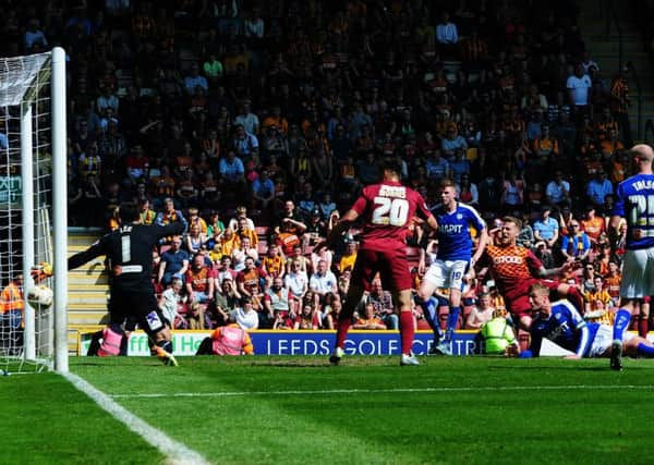 Bradford City's Billy Clarke scores his side's second goal against Chesterfield at Valley Parade.
 
Picture: Jonathan Gawthorpe