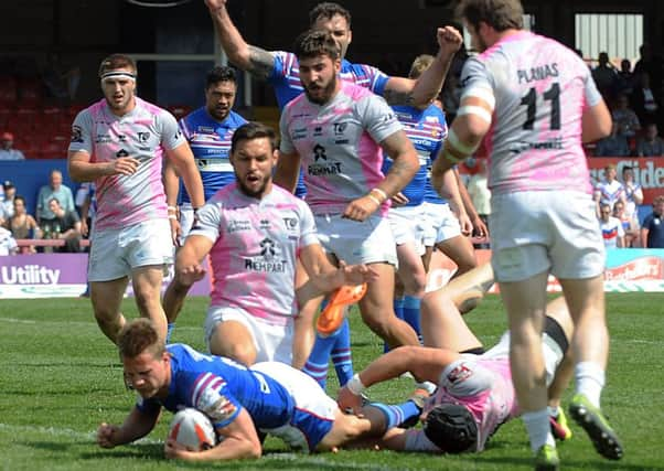 Wakefields Jacob Miller crashes over for a try against French side Toulouse in the Challenge Cup.