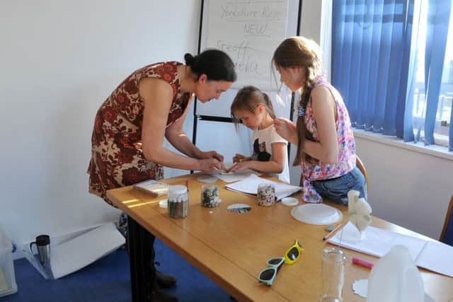 Children with one of the tutors at a Young Masters class