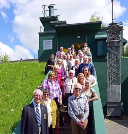 The staff reunite on the steps of the bunker. Picture: Anthony Chappel-Ross