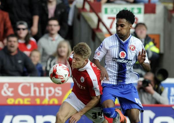 Lloyd Isgrove in action for Barnsley against Walsall