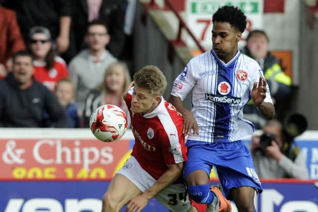 Lloyd Isgrove in action for Barnsley against Walsall