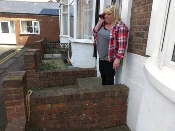 Shelly Malone was shocked to find a snake on her wall