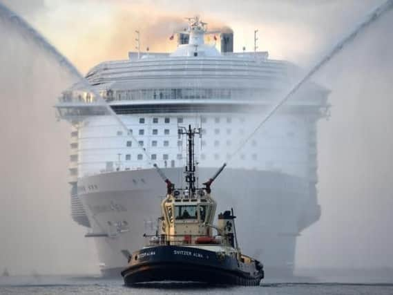 The world's largest passenger ship, MS Harmony of the Seas, owned by Royal Caribbean, makes her way up Southampton Water into Southampton ahead of her maiden cruise. Image: Andrew Matthews/PA Wire