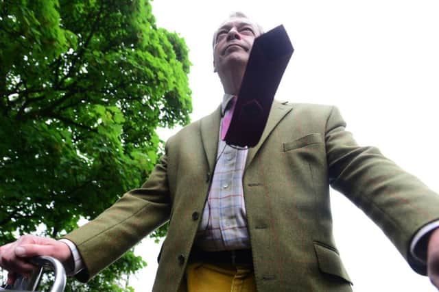 Nigel Farage ducks to avoid low-hanging branches as his open-top bus makes its way through Sheffield. Picture: Scott Merrylees