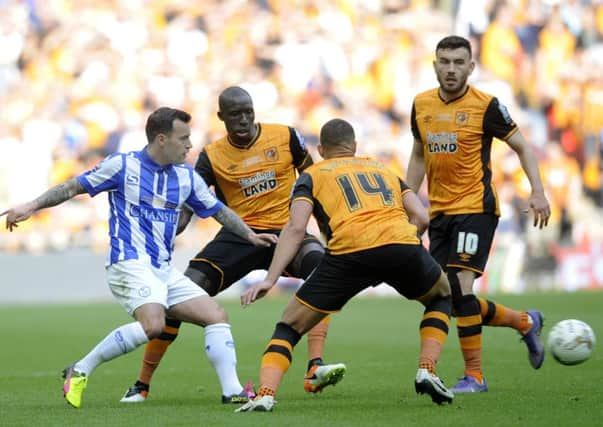 Wednesday's Ross Wallace threads a pass through a mass of City players. (Picture: Steve Ellis)