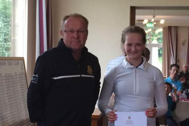 Bradley Park's Gabriella Child with Crosland Heath's junior organiser Mark Hughes.