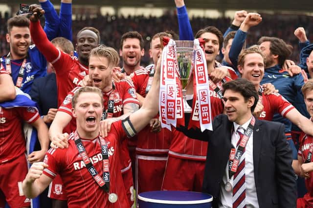 Middlesbrough Grant Leadbetter lifts the cup with Aitor Karanka as they celebrate returning to the Premier League