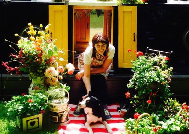 Julie on board Calamity Jane, her houseboat, which sparked the idea for her canalware-style designs