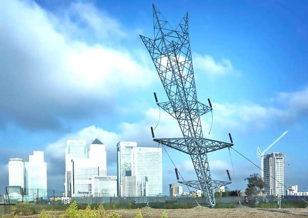 Alex Chinneck's A Bullet from a Shooting Star which appeared on wasteland near Canary Wharf. Picture Chris Tubbs.