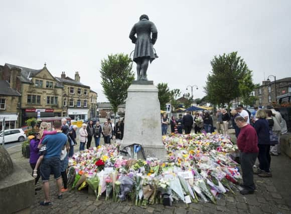 Floral tributes continue to grow in Birstall.