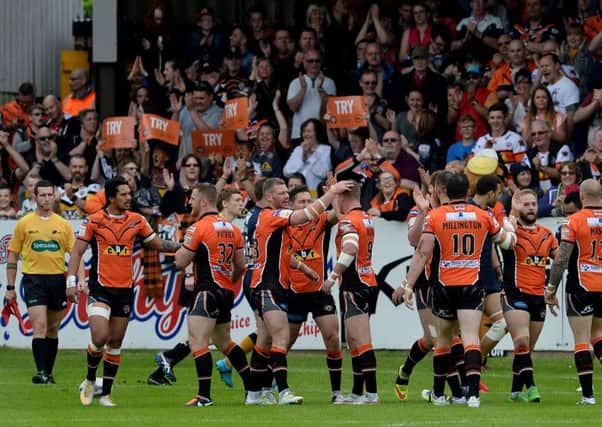 Castleford Tigers celebrate after Luke Dorn scores a try.