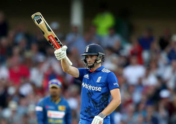 England's Chris Woakes celebrates reaching his half century against Sri Lanka at Trent Bridge on Tuesday night. Picture: Simon Cooper/PA.