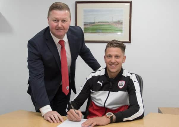 New Barnsley signing George Moncur with Reds chief executive Linton Brown.