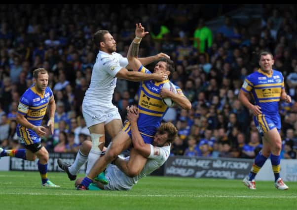 Leeds Rhinos Joel Moon is halted in his tracks during his sides one-point defeat yesterday against Widnes Vikings at Headingley (Picture: Steve Riding).