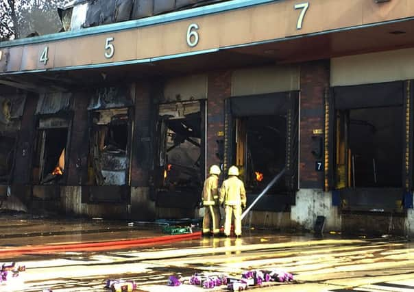 Firefighters at the scene following a blaze at a Morrisons bakery on a Wakefield industrial estate