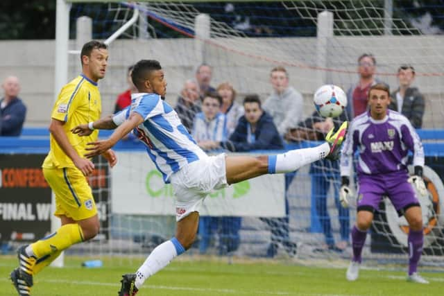 Huddersfield Towns new loan signing German striker Elias Kachunga, above and in pre-season action against Guiseley, inset. Pictures:  Huddersfield Town/John Early