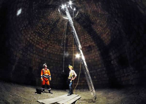 Mines rescue trainer Matrin Greaves and English Heritage senior curator Kevin Booth in the basement. Picture Scott Merrylees