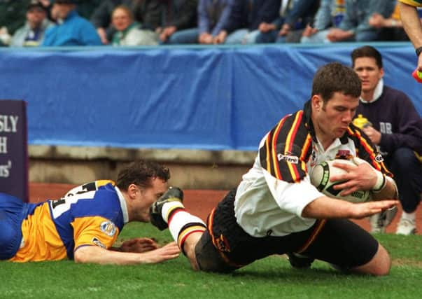 Rugby union convert, winger Jon Scales, touches down for the first of his hat-trick of tries for Bradford Bulls against former club Leeds in the 1996 Challenge Cup semi-final at Huddersfield (Picture: Bruce Rollinson).