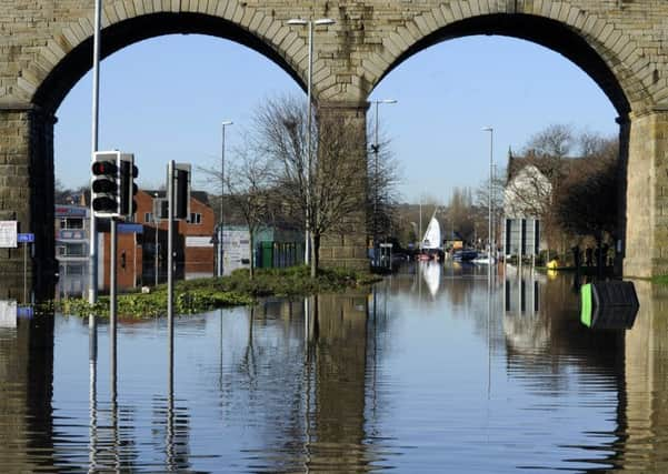 Emblematic of last winter's Yorkshire floods, Kirkstall Road, Leeds, also symbolises ongoing probelms with affordable flood insurance.