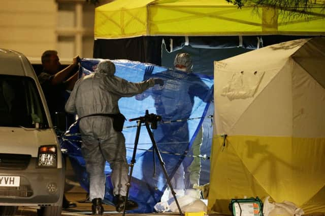 Police in Russell Square, central London, after a knife attack in which a woman in her 60s was killed and five people were injured. A 19-year-old man has been arrested.