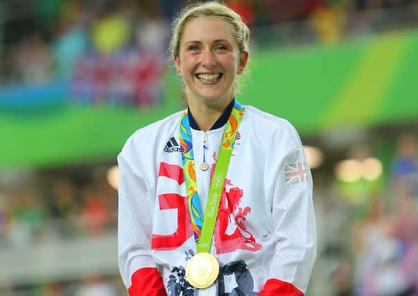 Great Britain's Laura Trott on the podium after winning gold in the Women's Omnium Points Race 6/6 at the Rio Olympic Velodrome on the eleventh day of the Rio Olympics Games, Brazil. Credit: David Davies/PA Wire.