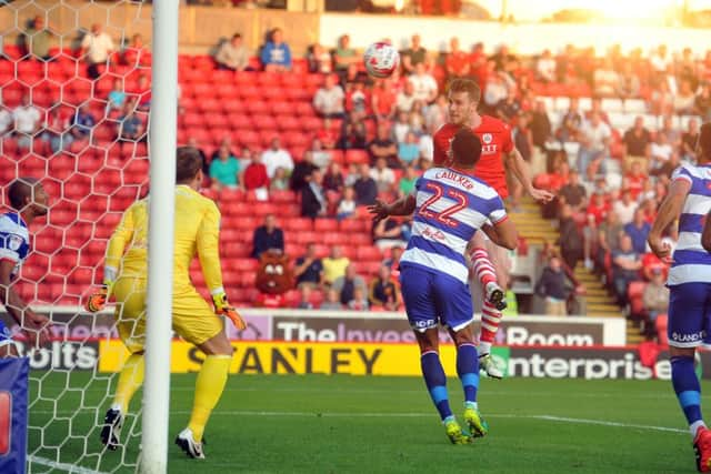 Barnsley's Marley Watkins heads in an early goal.  Pictures Tony Johnson