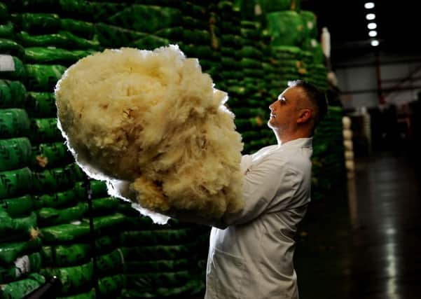 Senior Wool Head Grader Ian Brooksbank,checks the fleeces at the Wool House, Bradford.
Picture by Simon Hulme