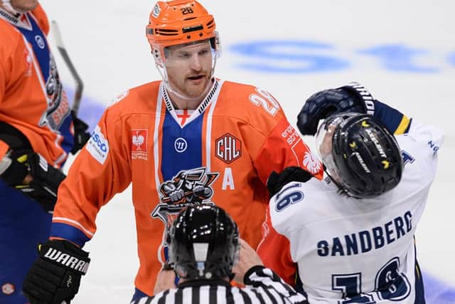 Zack Fitzgerald prepares to visit the penalty box after landing a blow on HV71's Filip Sandberg. Picture: Dean Woolley.