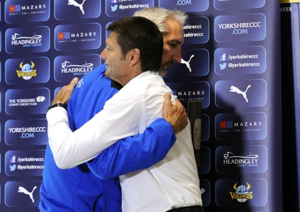 Head coach Jason Gillespie hugs director of cricket Martyn Moxon before explaining his decision to leave Yorkshire. (Picture: Simon Hulme)