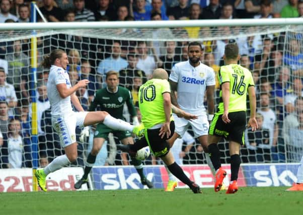 Huddersfield Town's Aaron Moy scores the only goal of the game against Leeds United (Picture: Jonathan Gawthorpe).