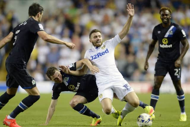 Leeds's Stuart Dallas is brought down by Blackburn's Corry Evans.  Picture Bruce Rollinson