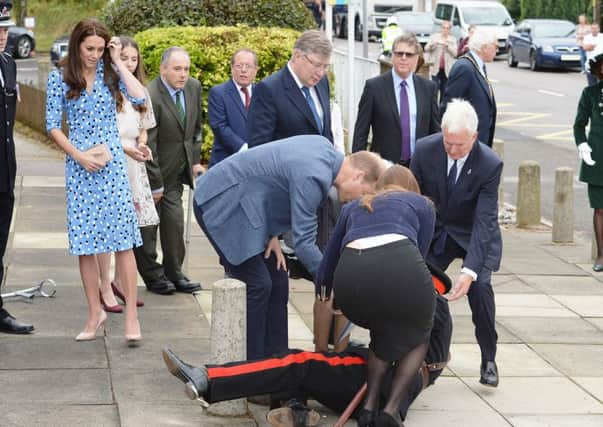 The Duke of Cambridge comes to the aid of Jonathan Douglas-Hughes, Vice Lord-Lieutenant of Essex when he took a tumble as he arrived at Stewards Academy in Harlow, Essex, where he and his wife the Duchess of Cambridge are promoting their Heads Together campaign, are finding out how young people are coping with life's pressures. PRESS ASSOCIATION Photo. Picture date: Friday September 16, 2016. See PA story ROYAL Cambridges. Photo credit should read: John Stillwell/PA Wire