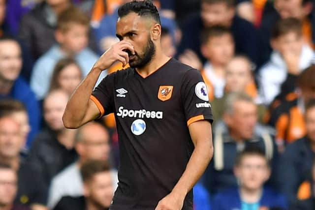 Hull City's Ahmed Elmohamady leaves the pitch after being sent-off during the Premier League match at Anfield, Liverpool.